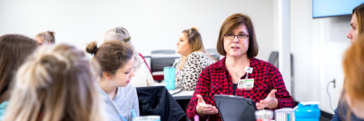 Department Director Sherry Muir leads a session