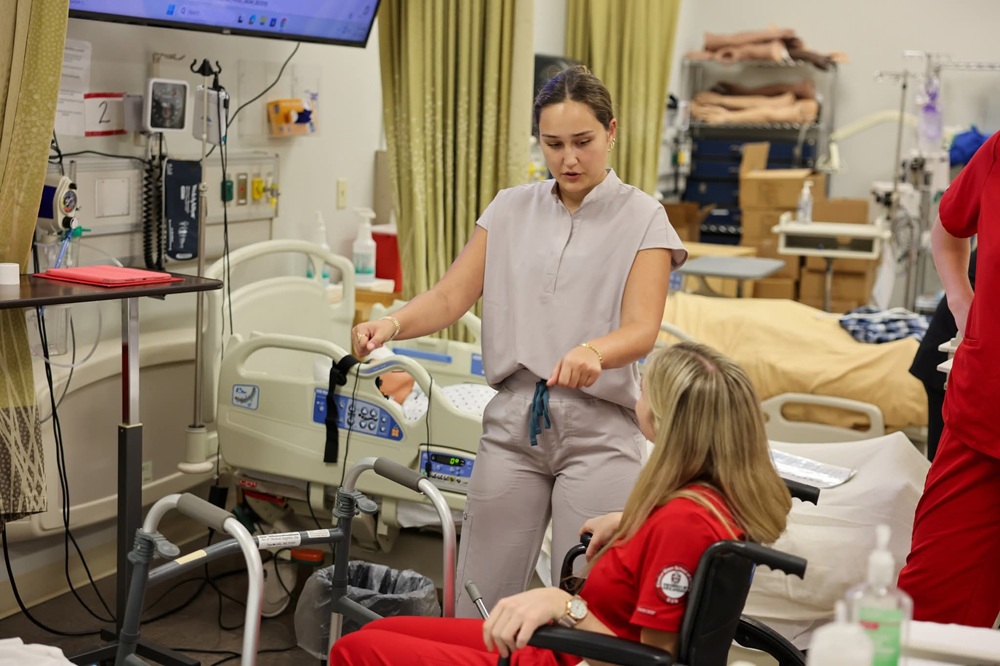 OT student working with nurses