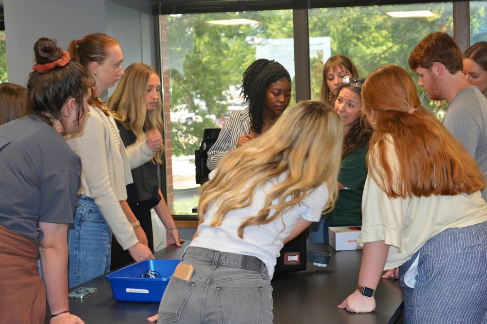 Students in Go Baby Go exercise